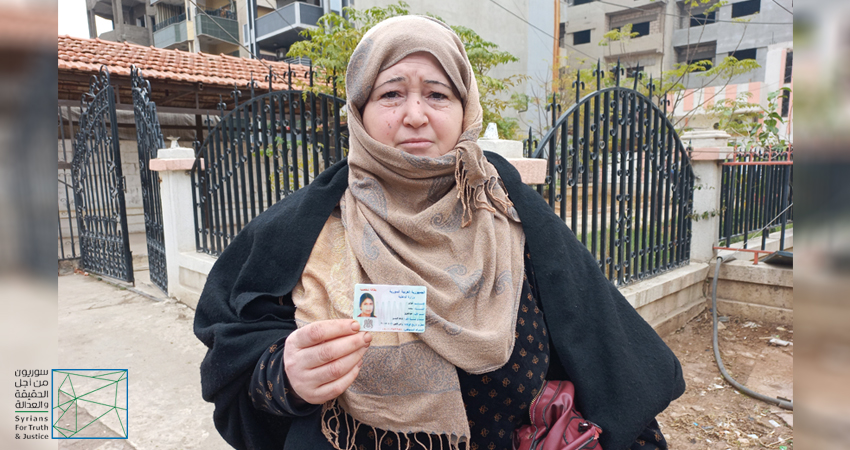A Kurdish woman holds up the ID card of her only daughter, who was recruited by the RY, at a sit-in in Syria’s northeastern city of Qamishli/Qamishlo. Credit: STJ.