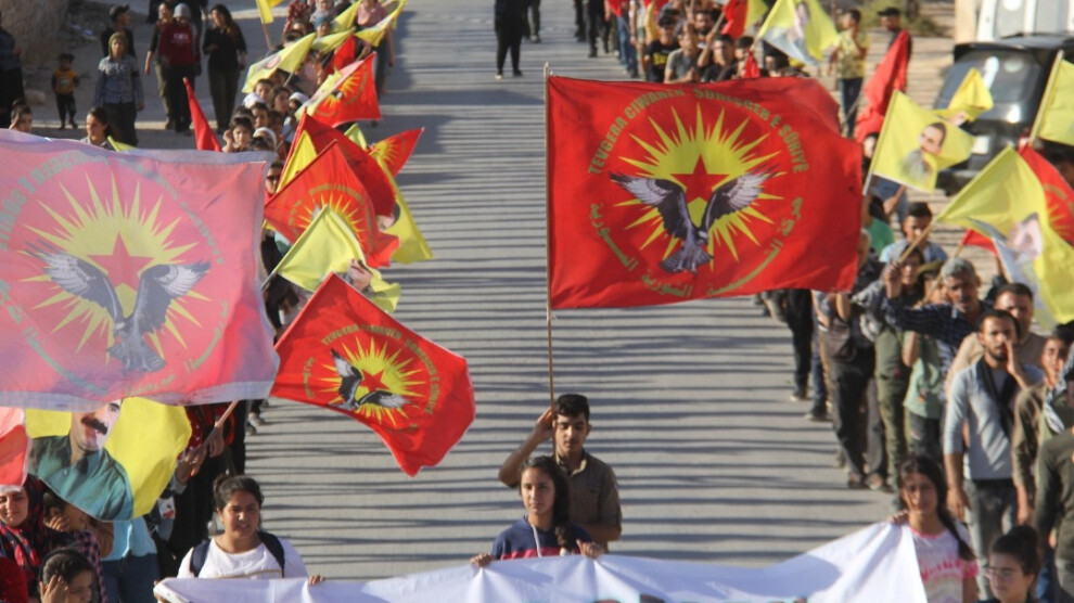 RY march in al-Shahbaa region in Aleppo suburbs. Group members are seen holding up RY flags.