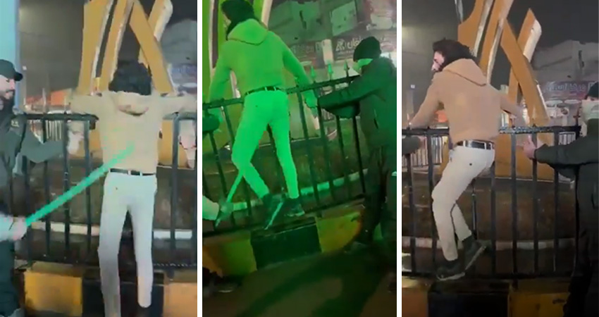 Screenshot from the flogging video, showing the young man hit with a rod on the back at the al-Center Roundabout in al-Bab city. Source: Local media outlet.