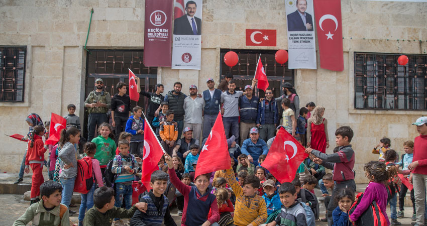 Turkish flags and symbols at a Syrian school in the Kurdish-majority Afrin in northwest Syria, after it was occupied by the Turkish army in 2018. Credit: Anadoluimages